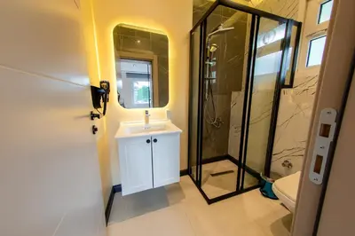 a bathroom with a white sink and a shower at Mateo in Istanbul