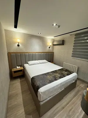a bedroom with a large bed in a room at Mateo in Istanbul