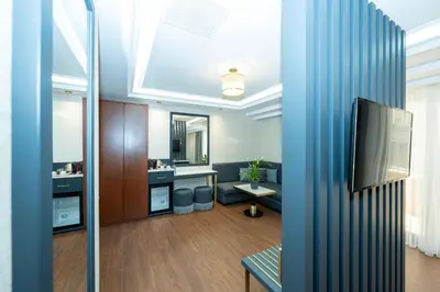 a room with a bathroom with a sink and a mirror at Freya Hotel in Istanbul