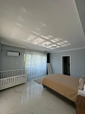 a white bedroom with a bed and a window at Sapanca Villa Dereiçi in Sapanca