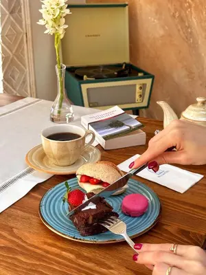 a table with a plate of food and a cup of coffee at Blu Macel Hotel & Suites -Old City Sultanahmet in Istanbul