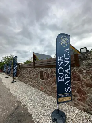 a row of signs in front of a building at ROSE SAPANCA STONE HOUSE in Sakarya