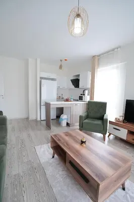 a living room with a couch and a coffee table at King Suite SA2 in Esenyurt