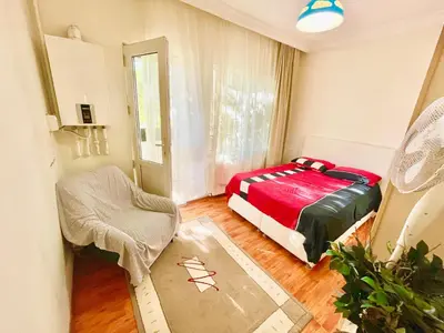 a bedroom with a bed and a chair in it at Best house for family in Istanbul