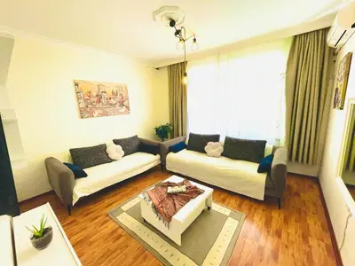 a living room with two couches and a table at Best house for family in Istanbul