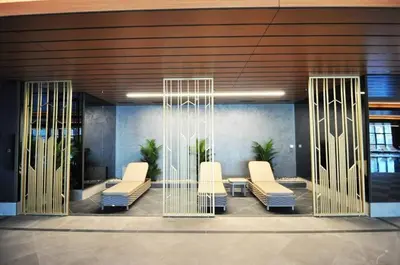 a lobby with white chairs in a building at Gorgeous Bright Studio Parking PoolViews! #135 in Istanbul