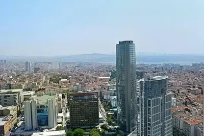 an aerial view of a city with a tall skyscraper at Beautiful Modern 1BD Condo Views w PoolGym! #223 in Istanbul