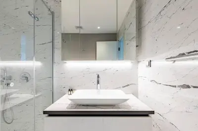 a white bathroom with a sink and a shower at Gorgeous Modern 1BD Terrace CondoPoolViews! #233 in Istanbul