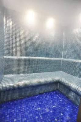 a blue tiled bathroom with a shower with blue tiles at Gorgeous Modern 1BD Terrace CondoPoolViews! #233 in Istanbul