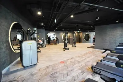 a gym with treadmills and exercise equipment in a room at Cozy Bright Studio w Parking, PoolViews! #237 in Istanbul