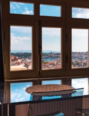 a view of the city from a window at Homie Suites - Turna Residences in Cihangir in Istanbul
