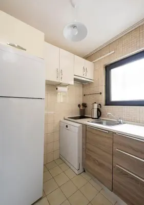 a kitchen with a white refrigerator and a sink at Modern Prime Location 2BD1Bath Cozy Home! #213 in Istanbul