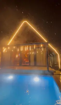 a house with a swimming pool at night at MİNNA BUTİK EV in Sapanca