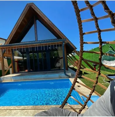 a swimming pool in front of a gazebo at MİNNA BUTİK EV in Sapanca