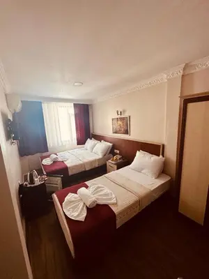 a hotel room with two beds in it at YUNUS OTEL in Istanbul