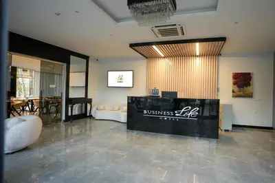 a lobby with a business line sign on the wall at Business Life Hotel Güneşli in Istanbul