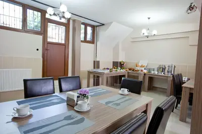 a dining room with a table and chairs at Birlik Apart Hotel in Istanbul