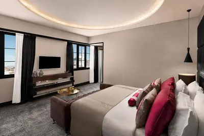 a bedroom with a large bed and a tv at Sura Hagia Sophia Hotel in Istanbul