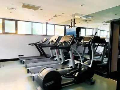 a gym with a row of treadmills at Sura Hagia Sophia Hotel in Istanbul