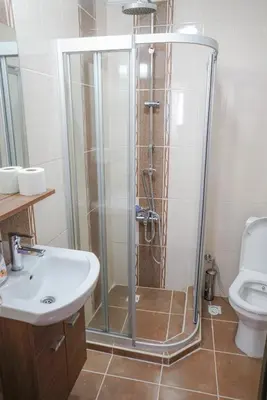 a shower in a bathroom with a sink and a toilet at My Way Tera Butik Otel in Adalar
