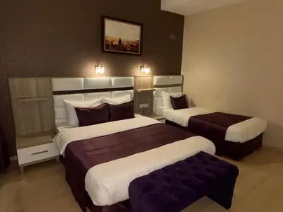 a hotel room with two beds in a room at Nil Hotel İstanbul City Center in Istanbul
