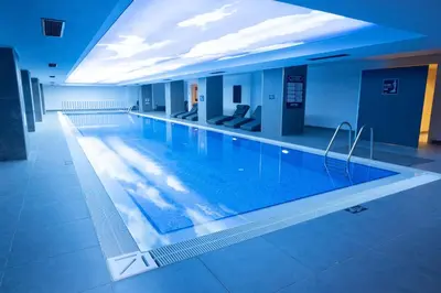 a large swimming pool in a hotel room at Park Inn by Radisson Yalova City Center in Yalova
