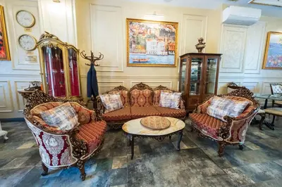 a living room with couches and chairs and a table at Solomon's Mansion Hotel Istanbul in Istanbul