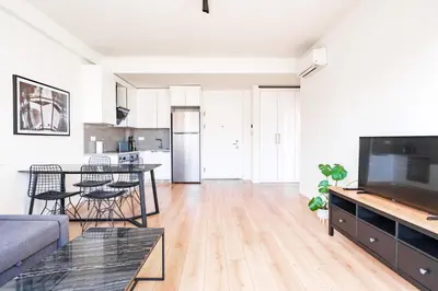 a living room with a couch and a table at Homie Suites - Luxury Apartments in Maçka in Istanbul