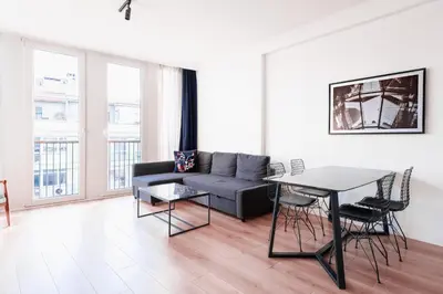 a living room with a couch and a table at Homie Suites - Luxury Apartments in Maçka in Istanbul