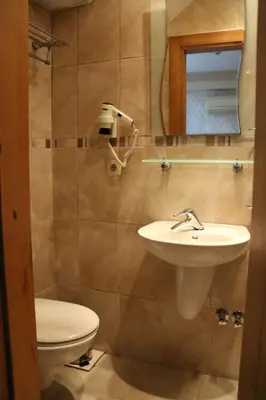 a bathroom with a sink and a toilet at Grand Peninsula Hotel in Istanbul