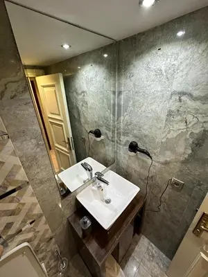 a bathroom with a sink and a mirror at Sahra Airport Hotel in Istanbul