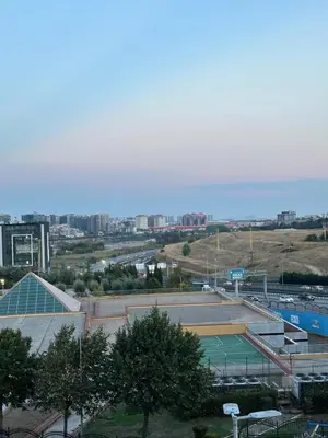 a view of a tennis court with a city in the background at Sahra Airport Hotel in Istanbul