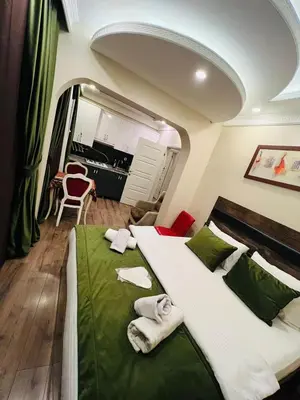 a bedroom with a large bed with towels on it at Bona apart in Istanbul