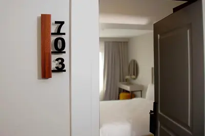 a bedroom with a bed and a clock on the wall at Joy Taksim in Istanbul