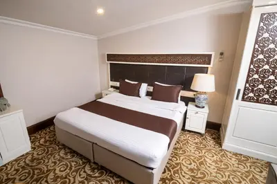 a bedroom with a large bed in a room at Şişli Luxury K Suites Hotel in Istanbul