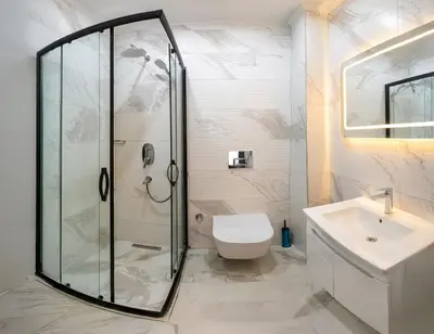 a bathroom with a shower and a toilet and a sink at hotel La Vitrine in Istanbul