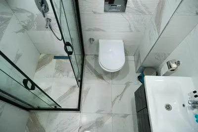 a bathroom with a shower and a toilet and a sink at hotel La Vitrine in Istanbul