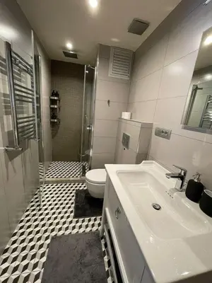a bathroom with a sink and a toilet at Myfair apartment in Istanbul