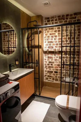a bathroom with a shower and a toilet and a sink at Alness Residence in Istanbul