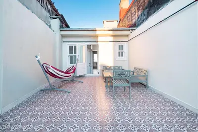 a balcony with a hammock and a table and chairs at Homie Suites - Historical Apartments in the center of Beşiktaş in Istanbul