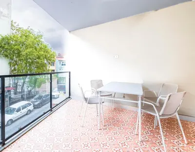 a dining room with a table and chairs and a window at Homie Suites - Historical Apartments in the center of Beşiktaş in Istanbul