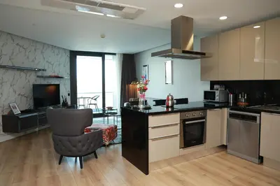 a kitchen with a counter and a chair in a room at Lovely One Plus One BDROOM-836 in Istanbul