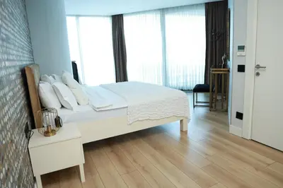 a bedroom with a white bed with white sheets and pillows at Lovely One Plus One BDROOM-836 in Istanbul