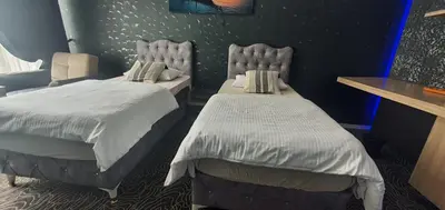 a room with two beds in a room at İNCİ HOUSE in Kırac