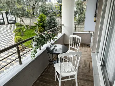 a balcony with two chairs and a table on a porch at Doğanın Kalbindeki Eviniz-6 Kişi in Gemlik