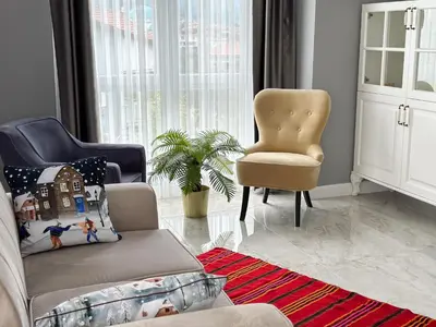 a living room with a couch and a chair at Doğanın Kalbindeki Eviniz-9 Kişi in Gemlik