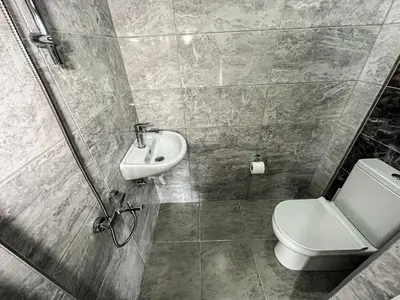 a bathroom with a toilet and a sink at Doğanın Kalbindeki Eviniz-9 Kişi in Gemlik