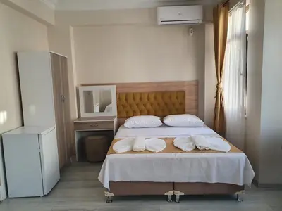 a bedroom with a bed with towels on it at Halil Bey Konağı in Istanbul