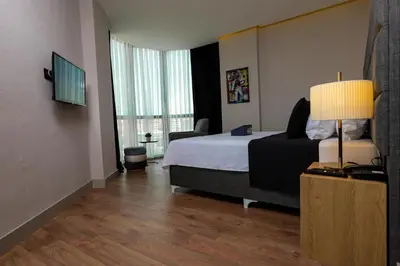 a hotel room with a bed and a window at Brand Business Hotel in Corlu