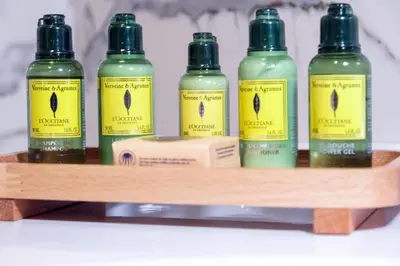 a shelf with four bottles of hair products on it at Brand Business Hotel in Corlu